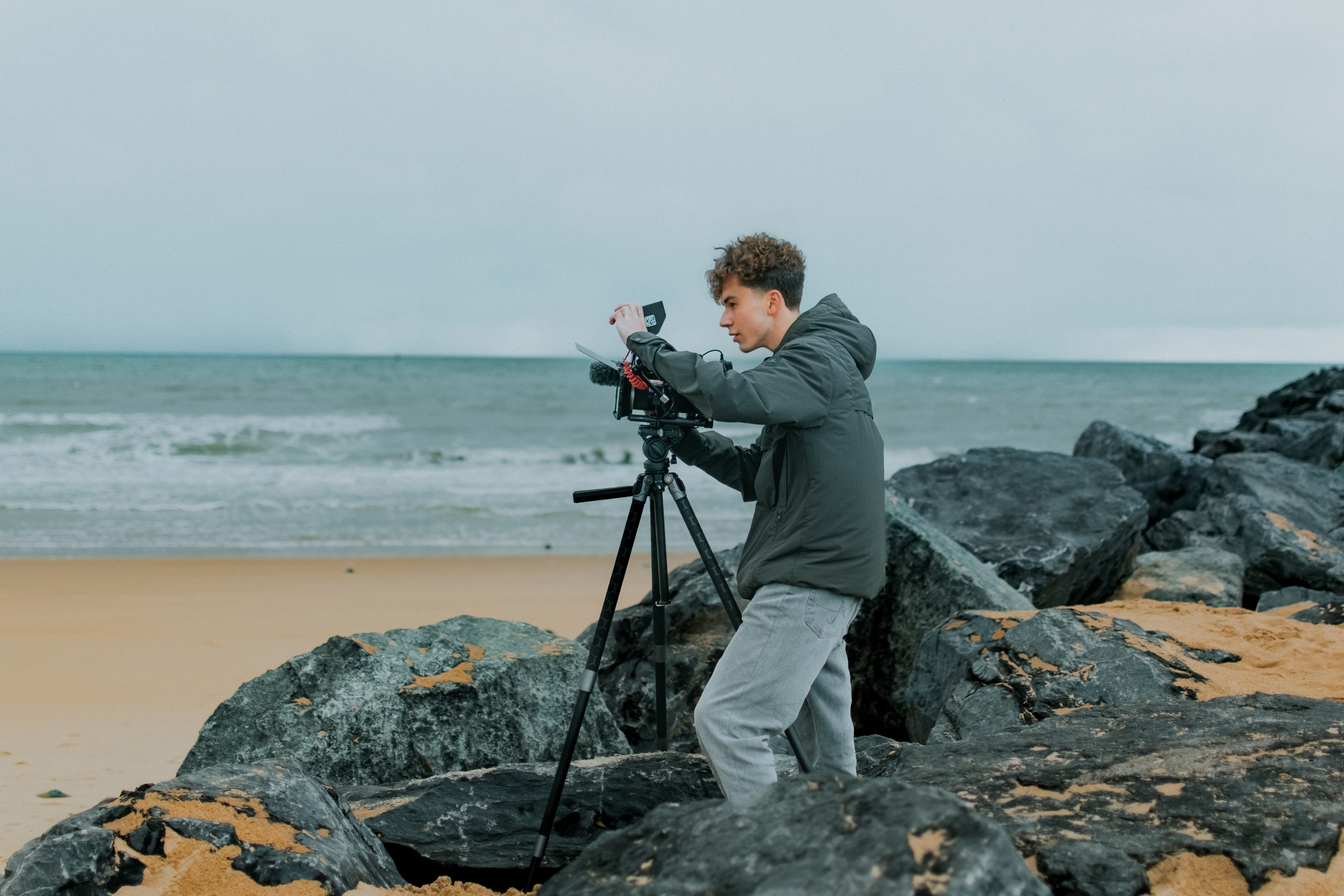 Portrait of the blog owner with face partially distorted through two clear glasses of water on a white table